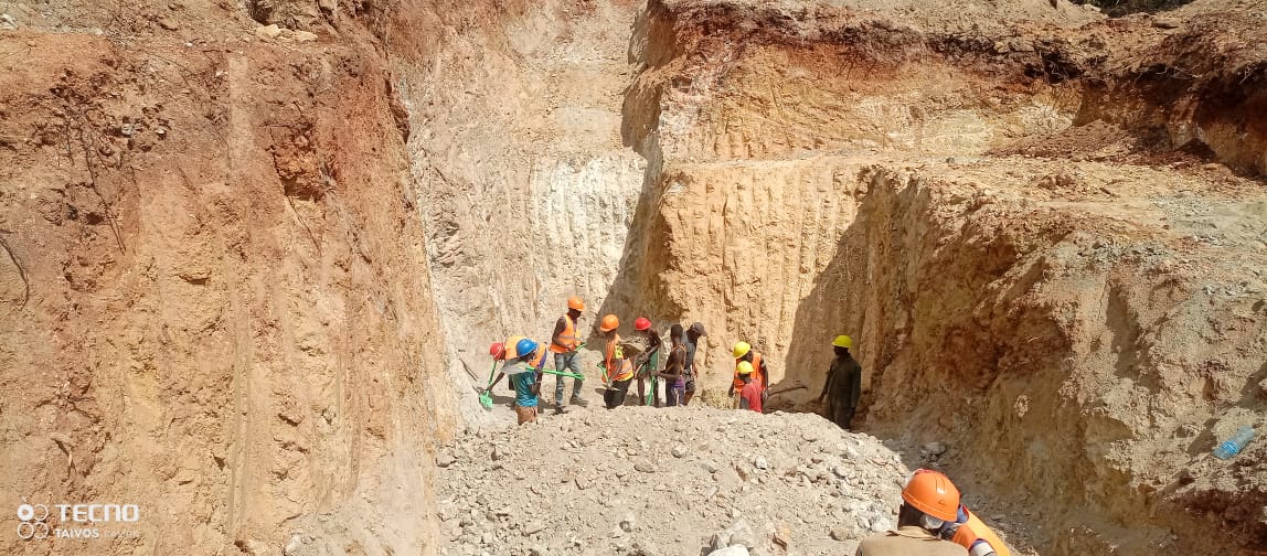 Mining team working together in a deep excavation